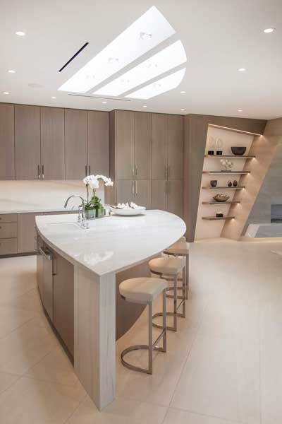 kitchen with extensive recessed lighting and under shelf lights.